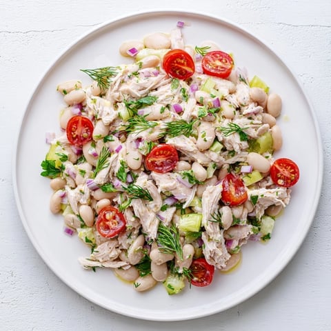 Tender chicken, creamy white beans, and crisp celery are tossed in a bright lemon vinaigrette for a refreshing Lemony White Bean Chicken Salad.