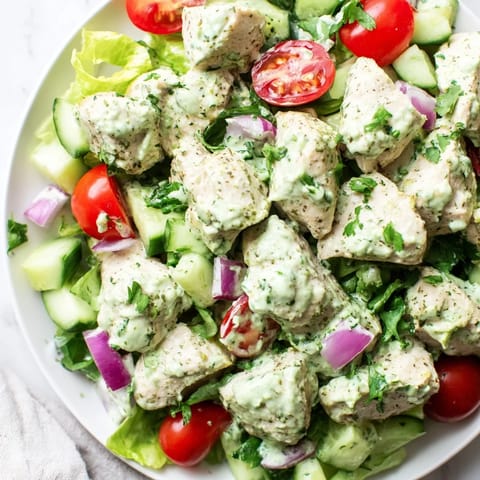 This Avocado Ranch Chicken Salad features juicy grilled chicken, diced celery, and red onion tossed with a cool, herby dressing for a fresh lunch.  