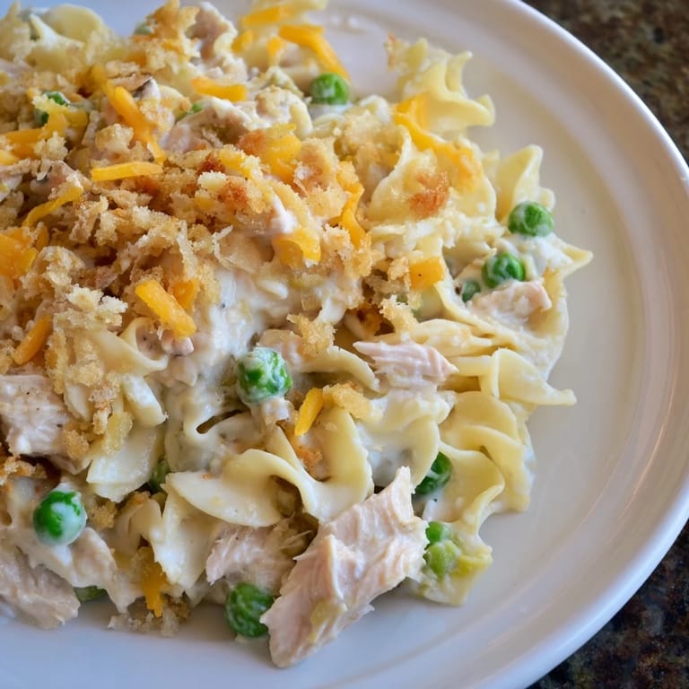 A creamy, hearty tuna casserole with peas and flaky tuna, perfect for a weeknight dinner.
